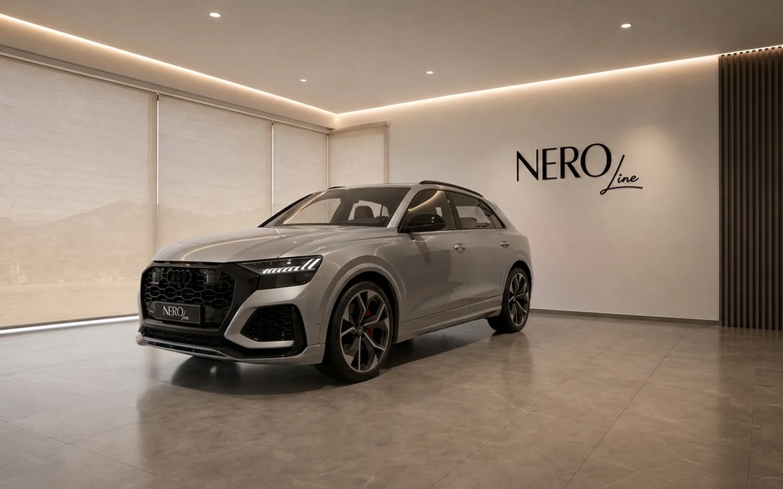Audi RS Q8 — Performance SUV in Lausanne showroom The silver 2022 Audi RS Q8, a performance SUV, is showcased from a front three-quarter angle in a modern Lausanne showroom.
