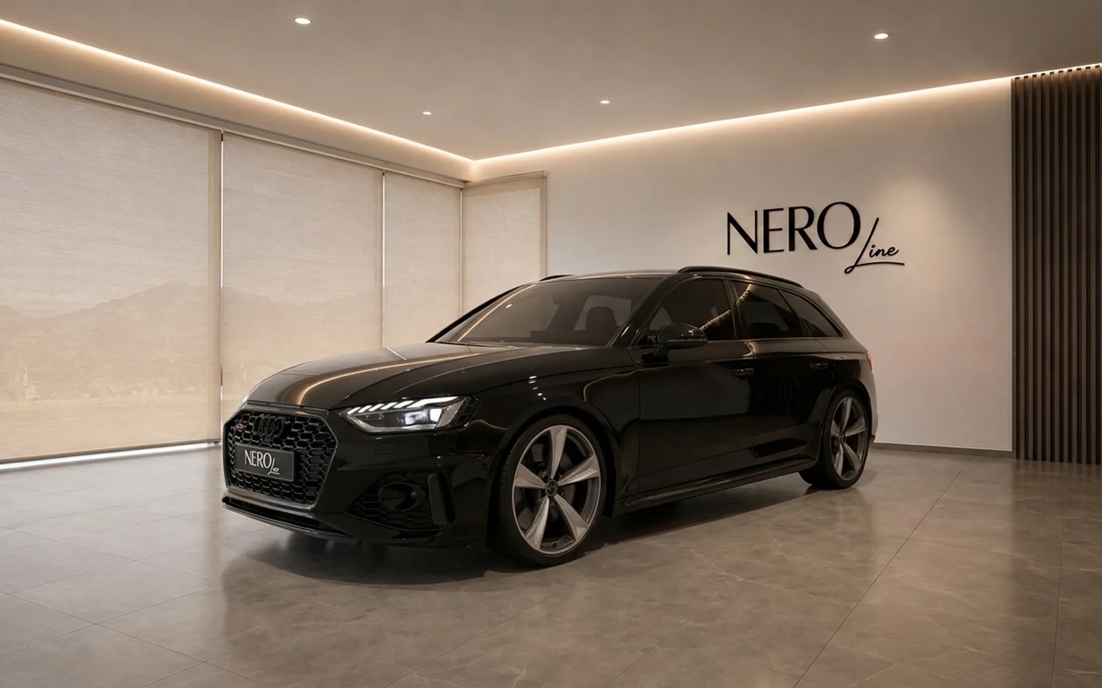 The black 2024 Audi RS4 Avant is showcased in a modern showroom with the Nero Line logo in Zurich.