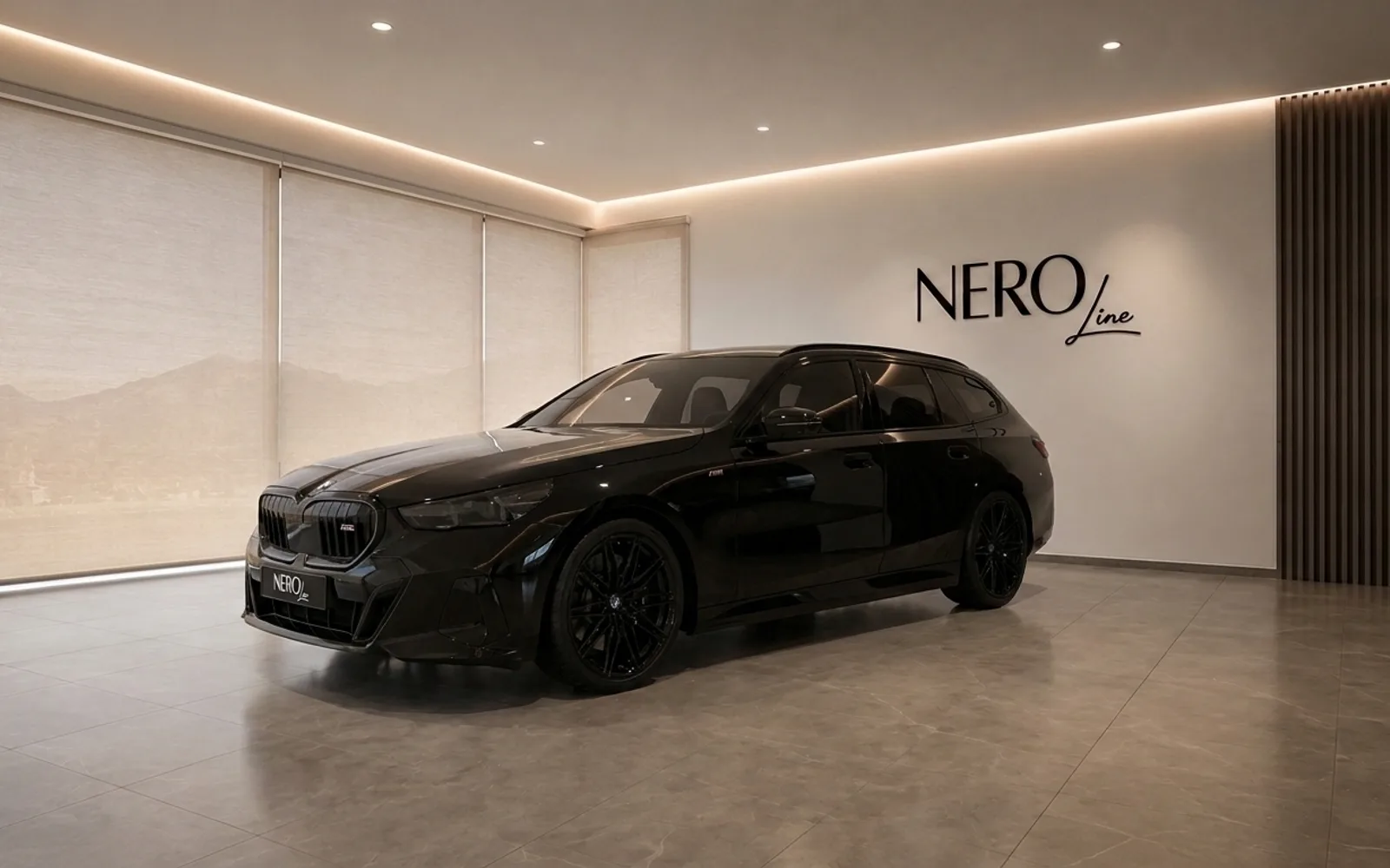 BMW M5 Touring — Modern showroom in Zurich The black 2025 BMW M5 Touring, shown from a front three-quarter angle, is parked in a modern NEROline showroom in Zurich.