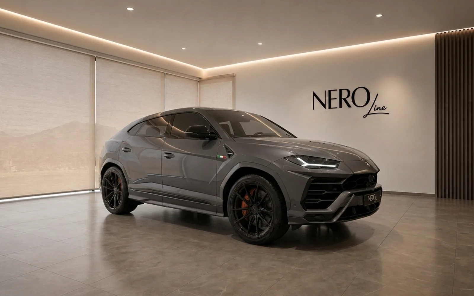 Lamborghini Urus — Modern showroom in Zurich A grey Lamborghini Urus is parked in a modern showroom with the NEROline logo on the wall, Zurich.