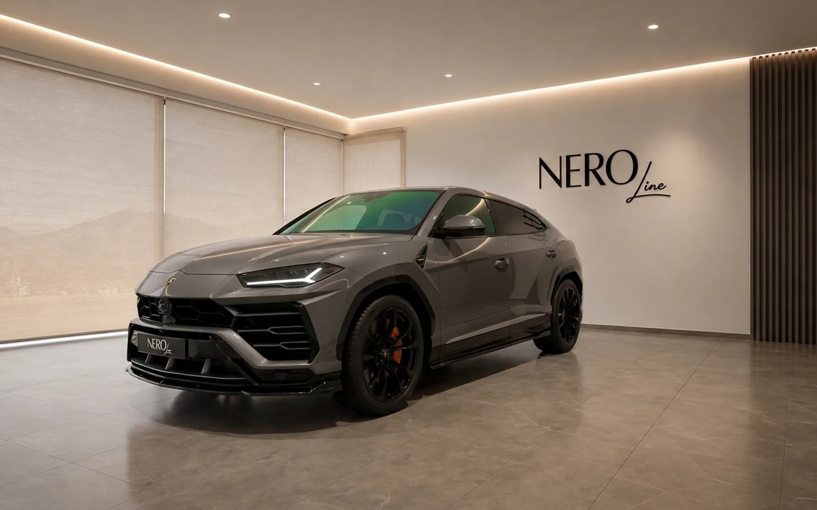 Lamborghini Urus — Front three-quarter view in Zurich showroom A grey 2021 Lamborghini Urus is parked at a front three-quarter angle in a modern showroom in Zurich, featuring the NEROline logo.
