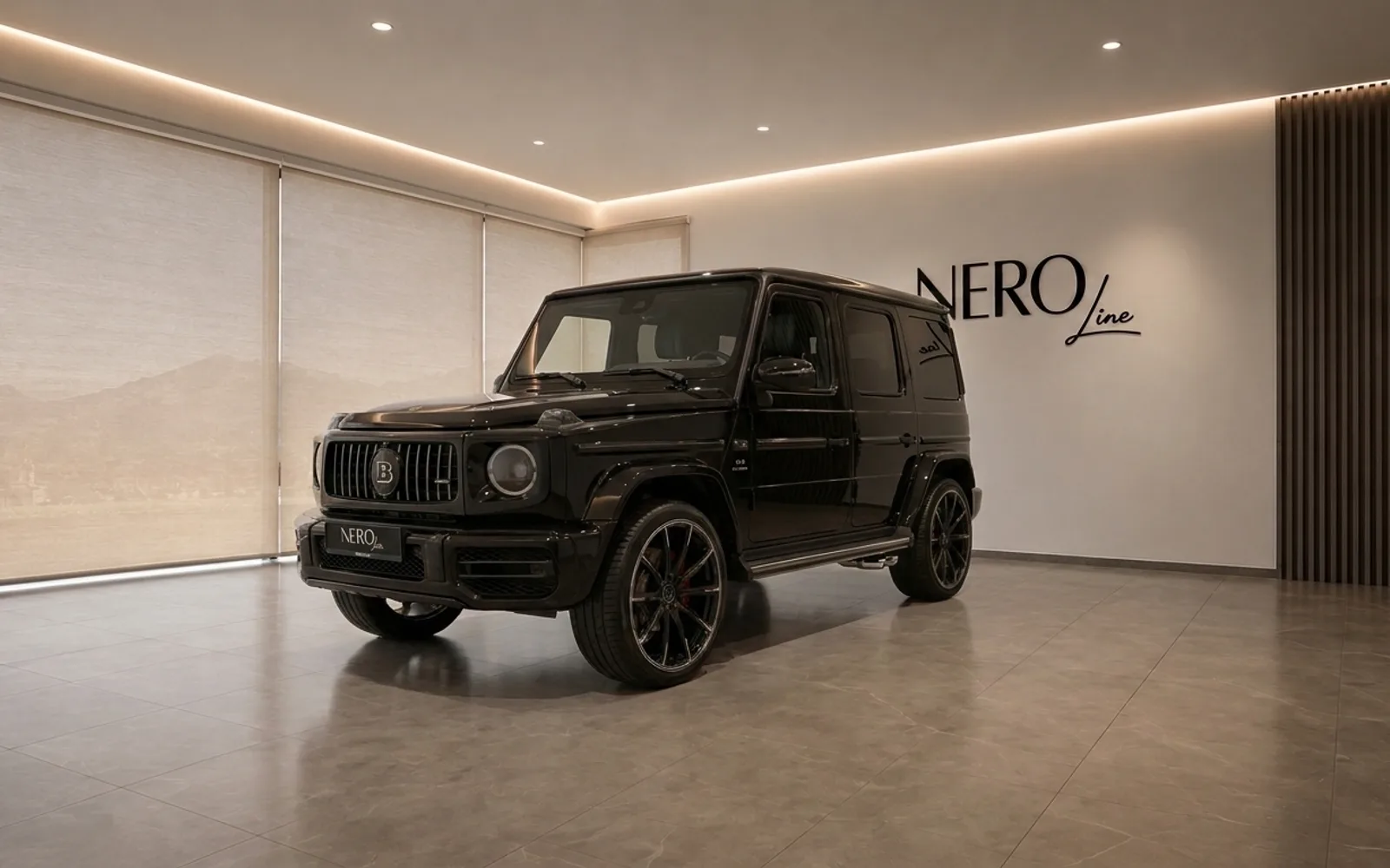 Mercedes-Benz G63 Brabus — Showroom display A gloss black Mercedes-Benz G63 Brabus is showcased in a modern showroom with the NEROline logo in Lausanne.