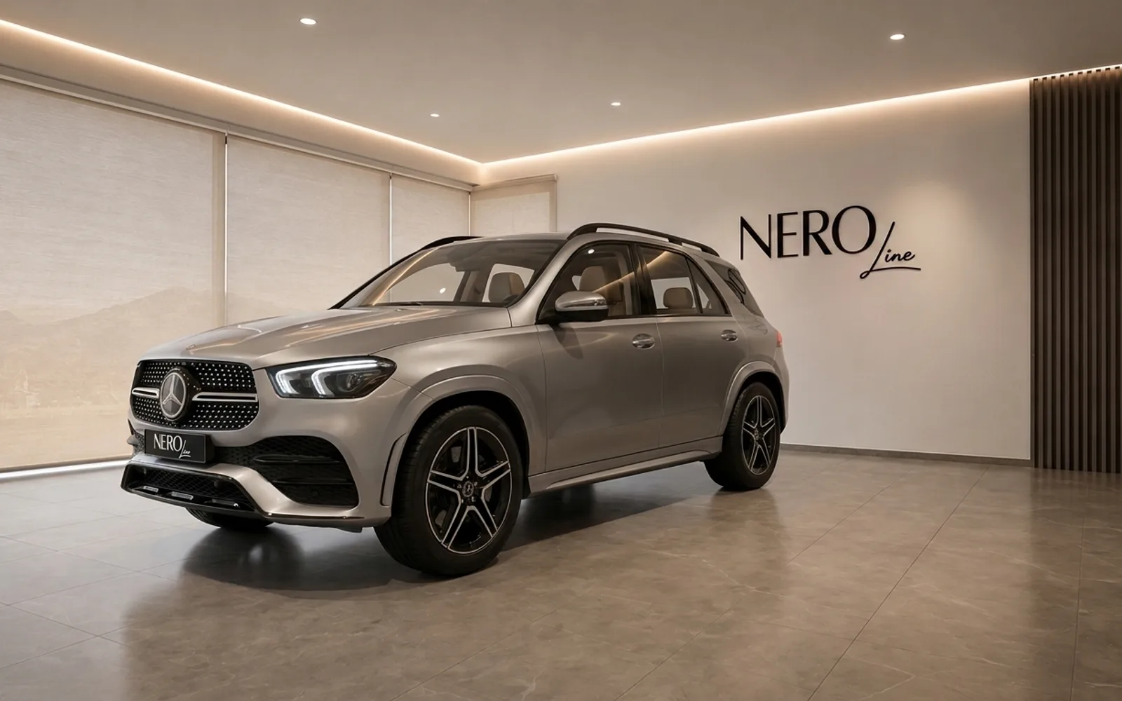 Mercedes-Benz GLE 350d — Luxury SUV in Lausanne A metallic silver Mercedes-Benz GLE 350d SUV is parked in a modern showroom with the NEROline logo, Lausanne.
