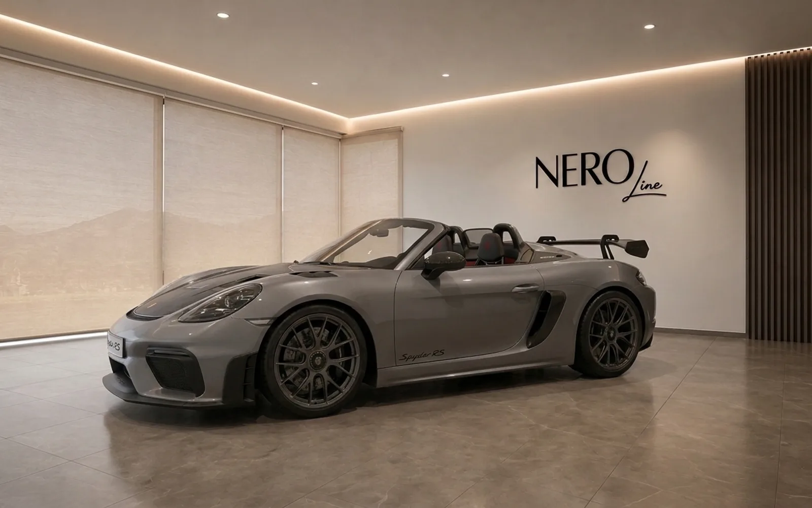 The grey Porsche 718 Spyder RS convertible is showcased from a side profile with its top down in a modern Zurich showroom.