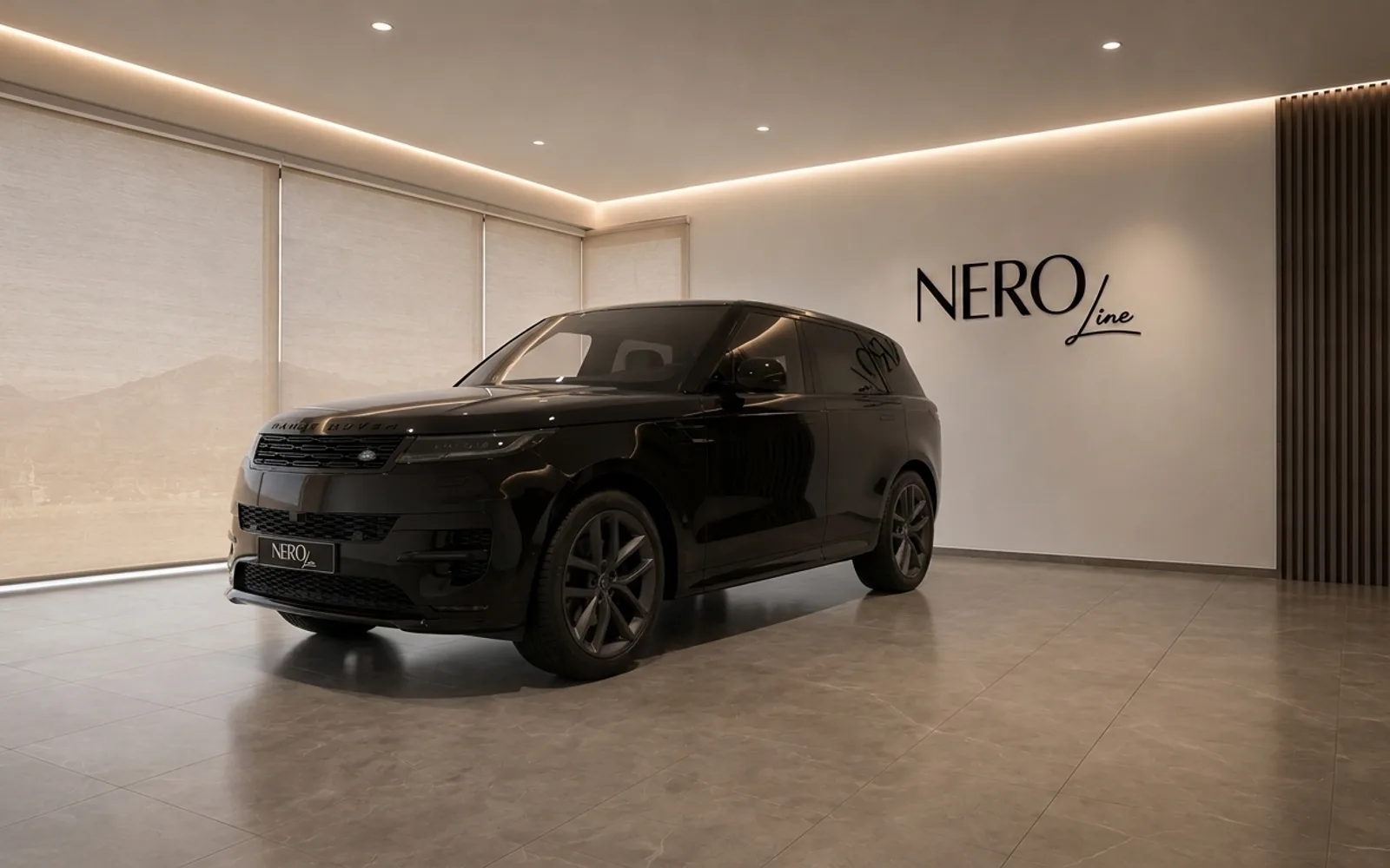 Land Rover Range Rover Sport — Showroom Lausanne A sleek gloss black 2023 Land Rover Range Rover Sport is displayed in a modern showroom in Lausanne, seen from the front three-quarter angle.