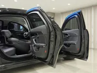 The Audi A8 L VR10 Armoured car's open rear and front doors reveal its luxurious black interior in Madrid.