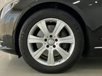 The Mercedes-Benz S 600 L GUARD's front wheel with a silver multi-spoke rim and Michelin tire, parked in Zurich.