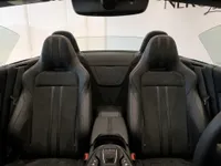 The luxurious black leather and Alcantara interior seats of the Aston Martin Vantage V8 Roadster in Lausanne.