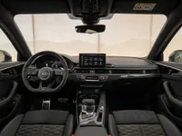 The luxurious interior of the 2024 Audi RS4 in Zurich, showcasing its advanced dashboard, steering wheel, and infotainment system.