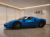 The gloss bright metallic blue Ferrari 296 GTS convertible is showcased from a side view in a modern showroom with the NeroLine logo, Lausanne.