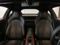 Ferrari 812 Superfast interior featuring black leather seats with red stitching and the cockpit view in Lausanne.