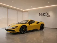 The yellow Ferrari SF90 Spider is prominently displayed in a modern showroom with the NEROline logo in Zurich.