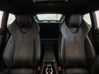 The luxurious black leather sports seats and center console of the Lamborghini Huracán Coupé in Zurich.
