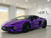 Lamborghini Temerario in Gloss Metallic Purple, shown from a front three-quarter angle inside a showroom in Madrid.