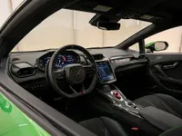 The luxurious interior of the 2025 Lamborghini Temerario in Zurich, showcasing the steering wheel, digital displays, and green accents.