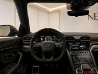 The luxurious cockpit and dashboard of the 2023 Lamborghini Urus Performante, featuring its distinctive steering wheel, in Zurich.