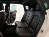 The luxurious black quilted leather rear seats with red stitching inside the Maserati Levante Trofeo in Zurich.