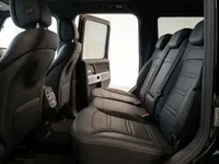 View of the black leather rear seats and open passenger door of the Mercedes-Benz G 63 in Zurich.