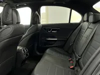 View of the Mercedes-Benz C63 AMG's luxurious dark grey leather rear seats and door panel in Alicante.