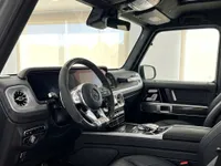 Mercedes-Benz G63 AMG luxury interior showing the steering wheel, dashboard, and black leather seats in Ibiza.