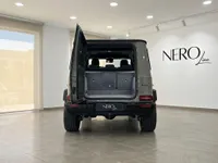 The rear view of the gloss Arabian Grey Mercedes-Benz G63 AMG in Ibiza, showcasing its spacious open boot.