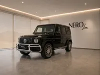 The black Mercedes-Benz G63 AMG is showcased in a modern showroom with the NEROline logo in Lausanne.