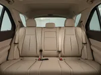 Rear view of the Mercedes-Benz GLE's luxurious beige leather interior, showcasing the spacious back seats in Lausanne.