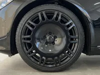 Close-up of the gloss black Brabus front wheel and tire on the Mercedes-Benz S 450 4MATIC in Alicante, Spain.