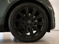 Land Rover Range Rover's dark green front fender and glossy black multi-spoke wheel with the Land Rover logo, in Lausanne.