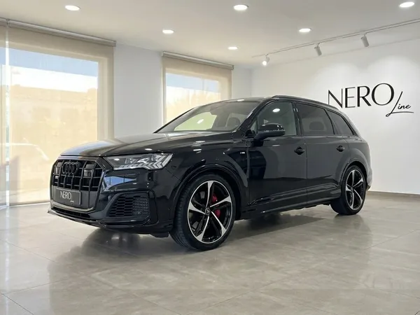 Black 2021 Audi SQ7 performance SUV parked in a showroom in Marbella, showcasing its front three-quarter view.
