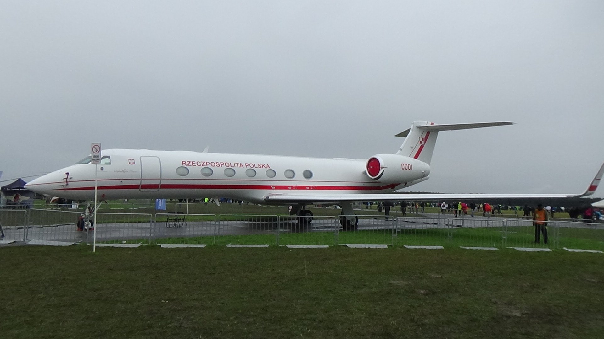 Gulfstream G550 — Ultra-long-range jet exterior A sleek white Gulfstream G550 ultra-long-range private jet is parked on an airfield, showcasing its exterior side profile.