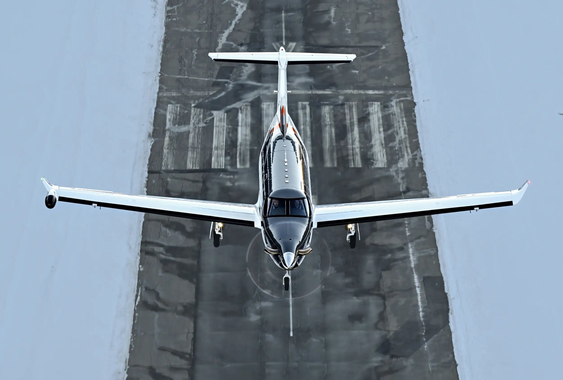 Pilatus PC-12 — Front view on runway The Pilatus PC-12 turboprop is seen from a front-on, elevated view, on a runway in Malaga, ready for flight.