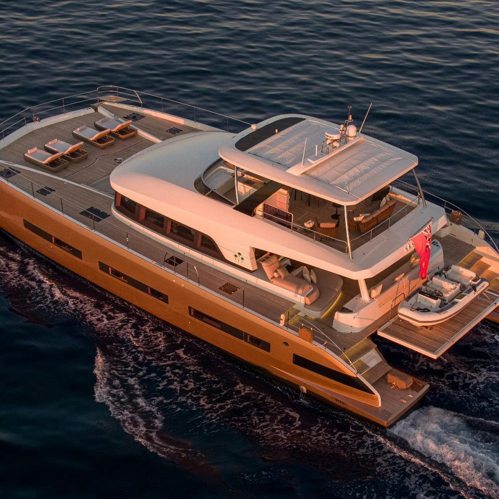 Lagoon Seventy 8 — Aerial view near Mallorca The Lagoon Seventy 8 catamaran, with its expansive flybridge and beach club, cruises the waters near Mallorca at sunset.