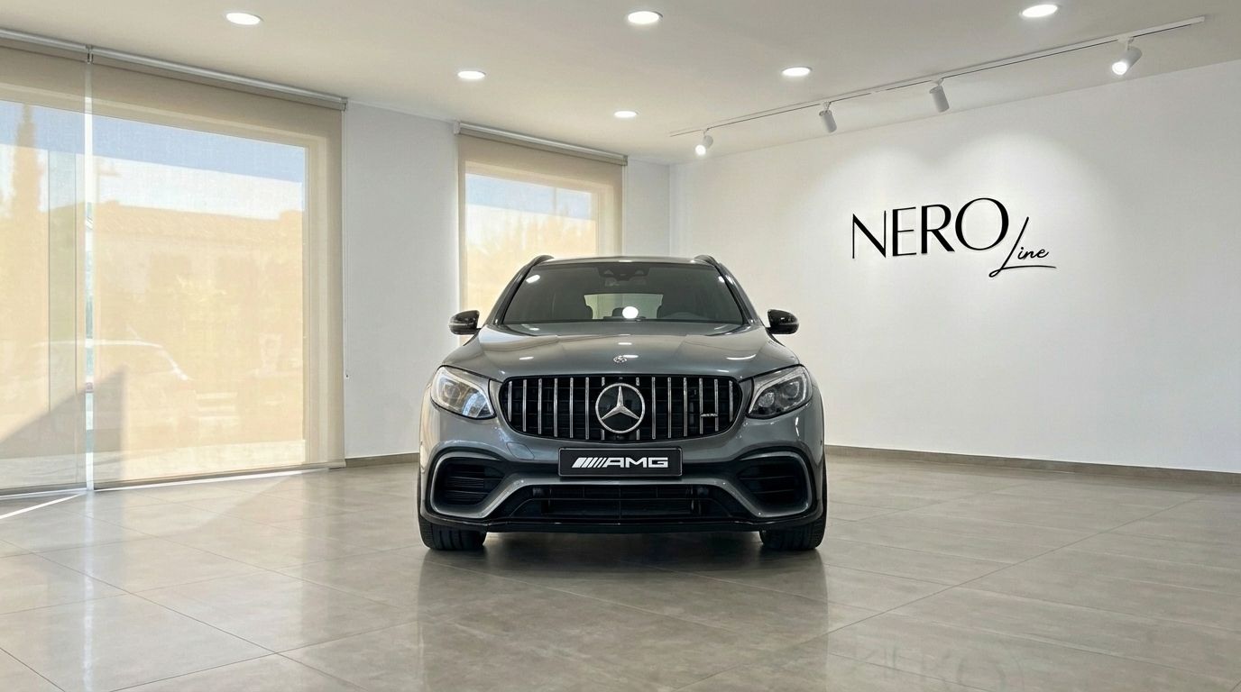 Front view of the metallic gray Mercedes-Benz GLC 63 S AMG in a bright showroom in Alicante.