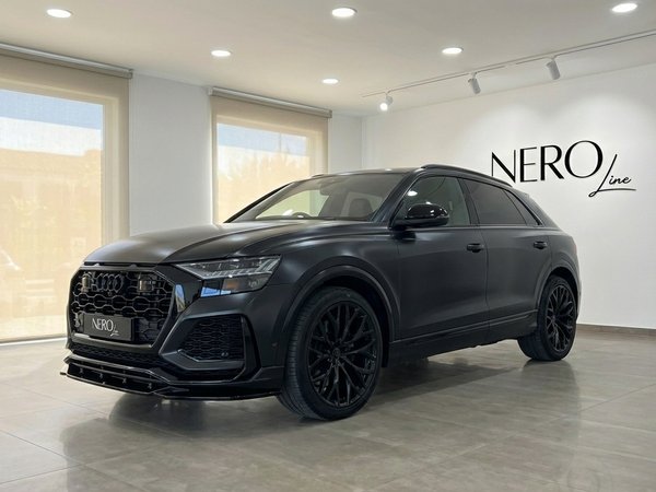 Audi SQ8 RS Body
— Matte Black Showroom View A matte black Audi SQ8 RS Body, 2020 model, displayed in a showroom in Alicante, Spain, showcasing its aggressive front design.