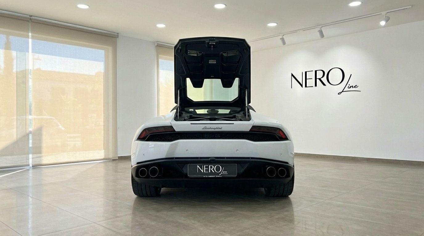 Rear view of a white Lamborghini Huracan Spyder LP610-4 with its engine bay open, parked in a showroom in Alicante.