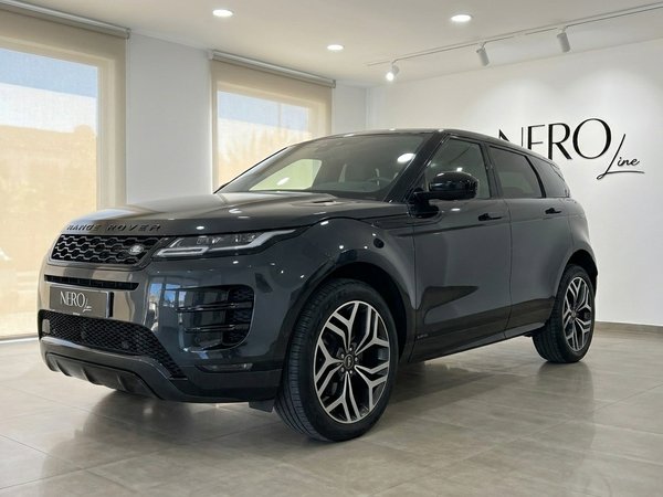 Land Rover Range Rover Evoque R-Dynamic — Showroom A dark grey Land Rover Range Rover Evoque R-Dynamic (1st) is showcased from a front three-quarter angle inside a modern showroom in Alicante.