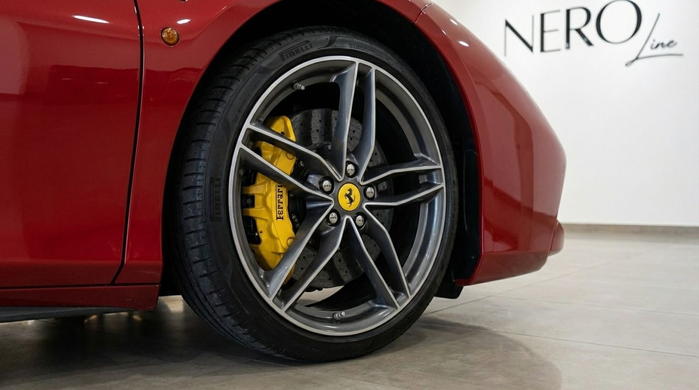 The Ferrari 488 Spider's racing red body and front wheel with grey multi-spoke rim and yellow brake caliper are visible in Alicante.