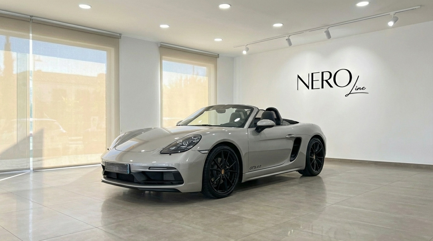 Porsche 718 Boxster 4.0 GTS — Luxury Convertible The metallic silver Porsche 718 Boxster 4.0 GTS convertible is parked in a showroom in Marbella, showcasing its sleek design.
