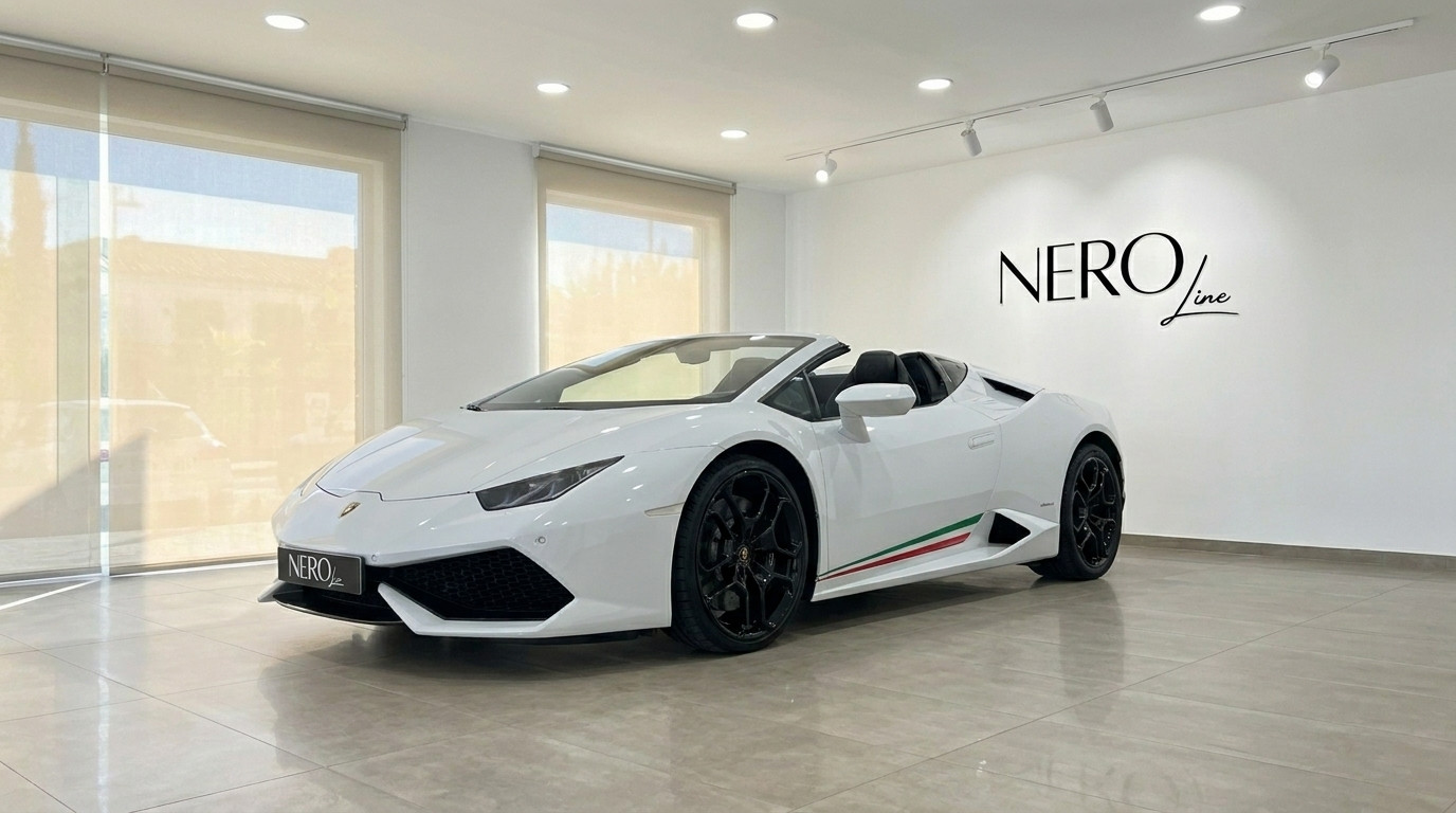 Lamborghini Huracan Spyder LP610-4 — Showroom Alicante The white Lamborghini Huracan Spyder LP610-4 is showcased from a front three-quarter angle with its top down in an Alicante showroom.