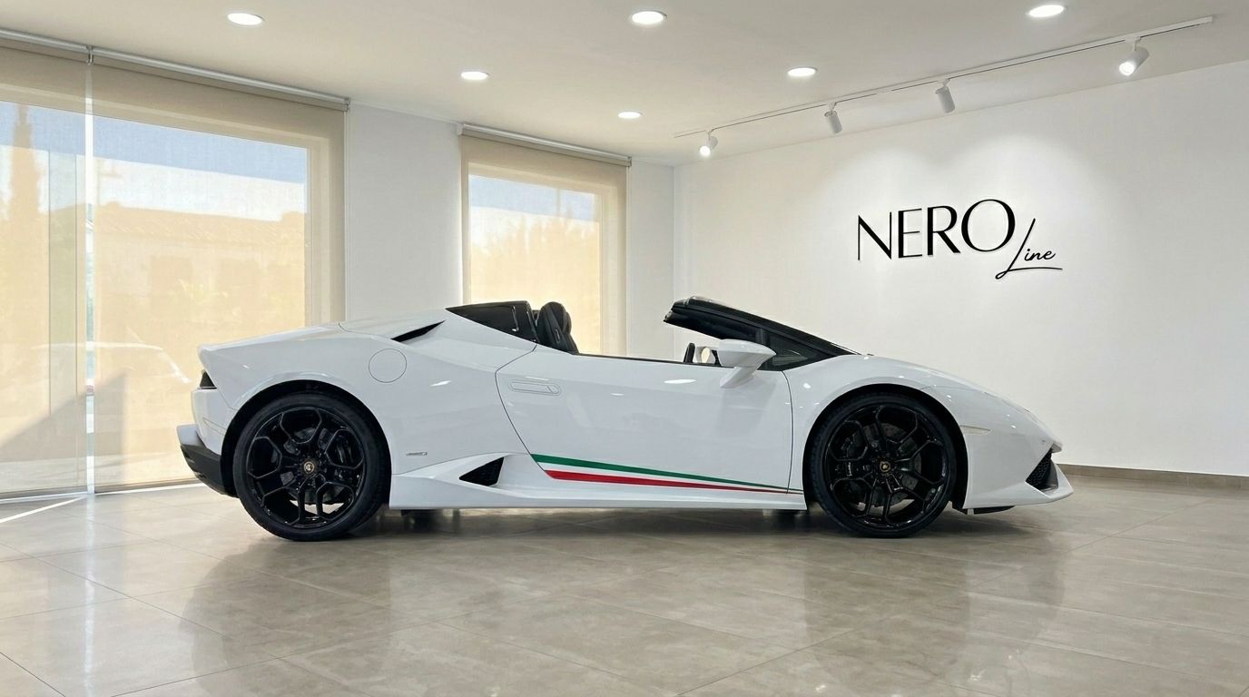 White Lamborghini Huracan Spyder LP610-4 convertible with Italian flag stripe, side profile, in a showroom in Alicante.