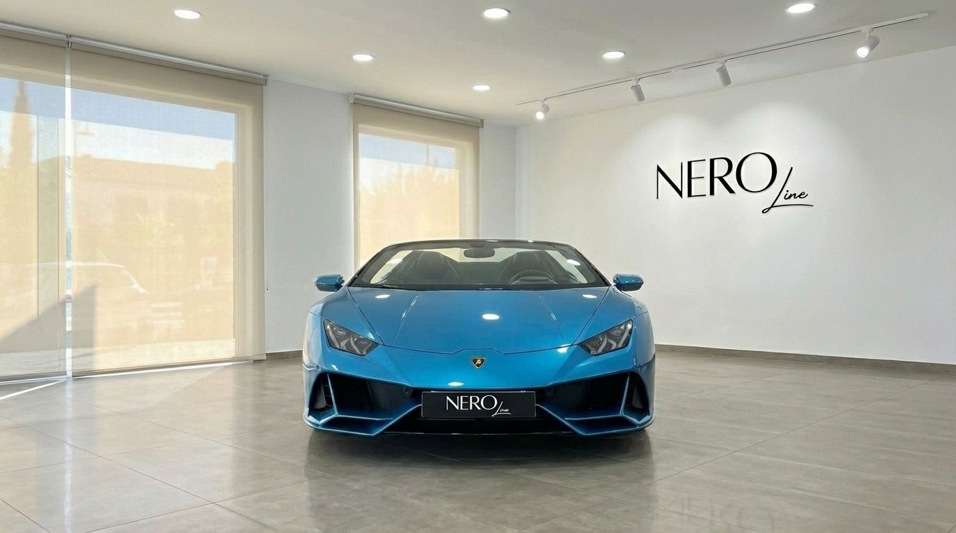 A metallic blue Lamborghini Huracan Evo Spyder convertible is showcased from the front view in a bright showroom in Marbella.
