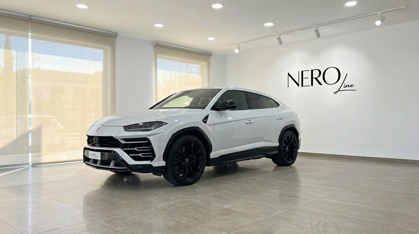 A pearl white Lamborghini Urus Super 2023 model, seen from the front three-quarter angle in a showroom in Alicante.