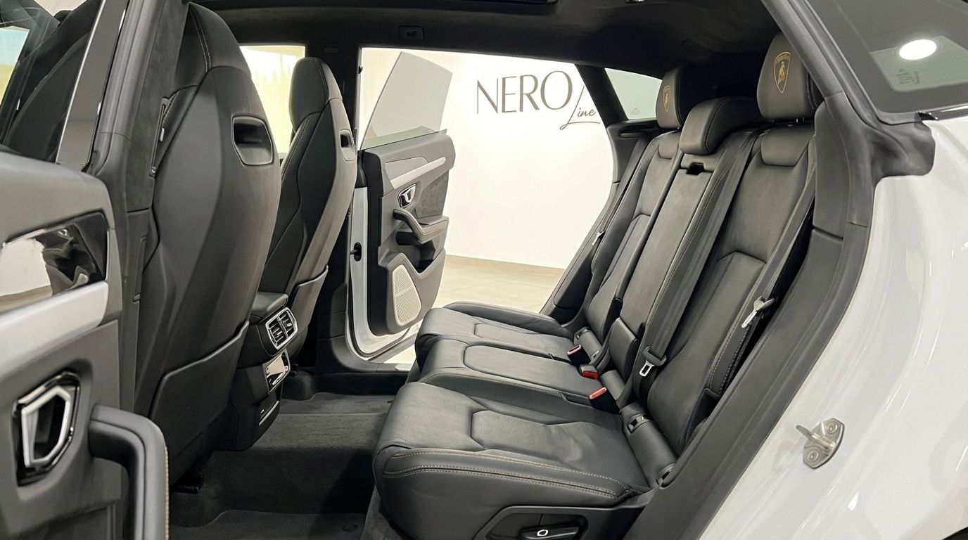 The luxurious black leather rear seats and interior details of the Lamborghini Urus Super available in Alicante.