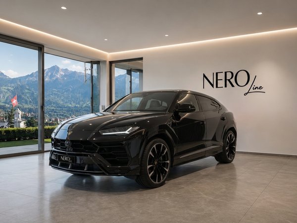 Lamborghini Urus — Showroom view in Zurich A black Lamborghini Urus is parked in a modern showroom with a panoramic view of the mountains in Zurich.