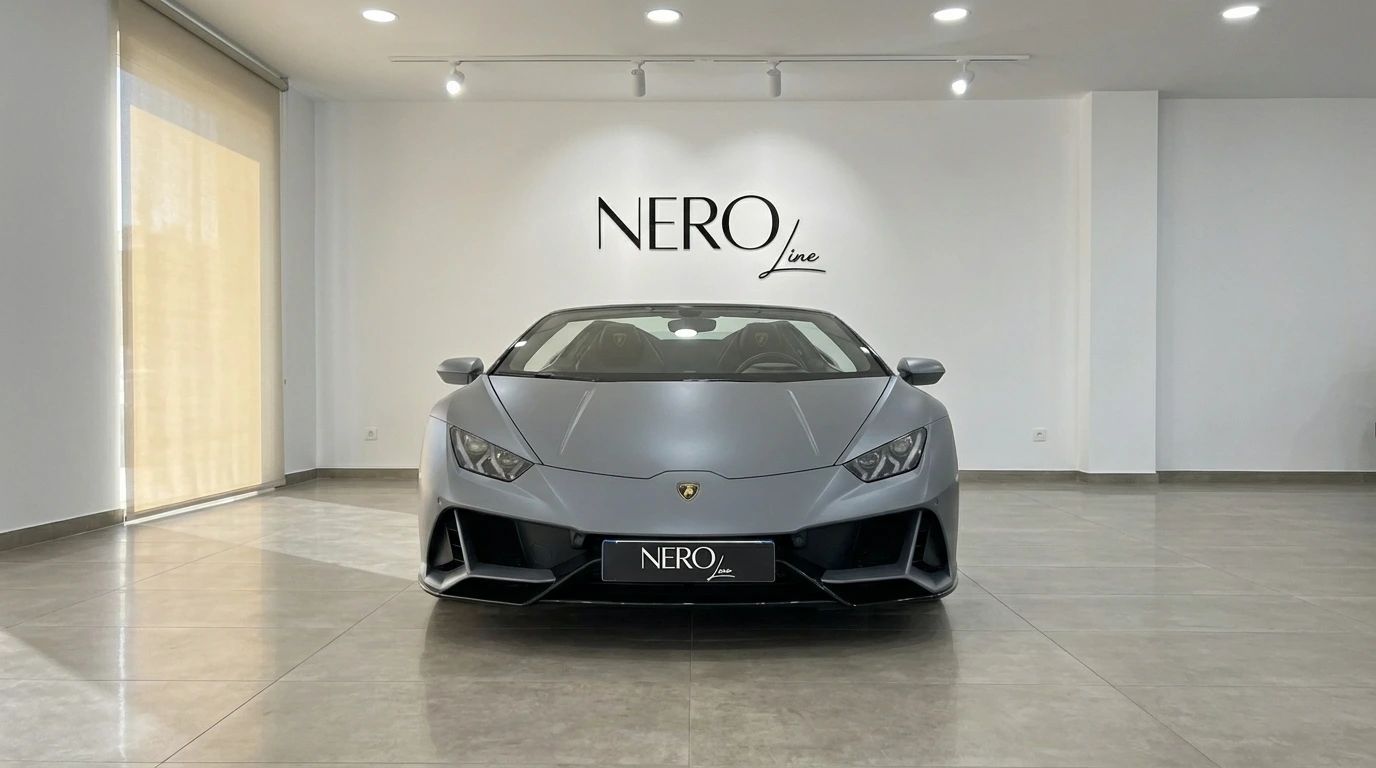 The matte gray Lamborghini Huracan Evo Spyder 60th Anniversary is showcased from the front in a bright showroom in Ibiza.