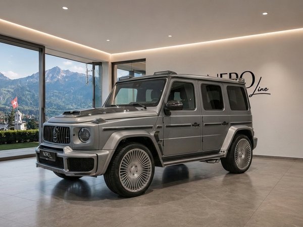 Mercedes-Benz G63 AMG — Showroom in Zurich The grey Mercedes-Benz G63 AMG is showcased in a modern showroom with a stunning mountain view in Zurich.