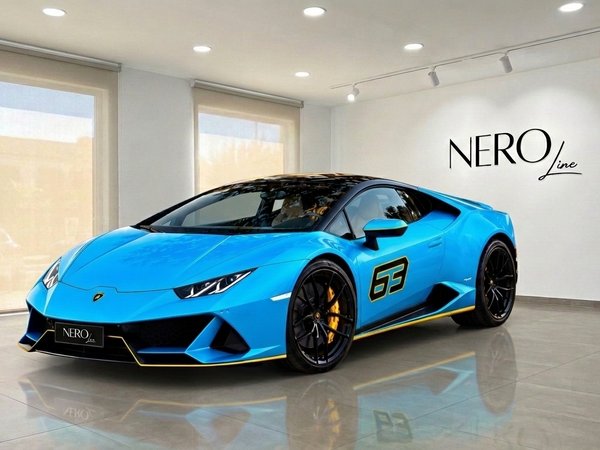Lamborghini Huracan LP610-4 — Showroom in Madrid A vibrant blue Lamborghini Huracan LP610-4, featuring yellow accents and a "63" decal, is parked in a Madrid showroom.