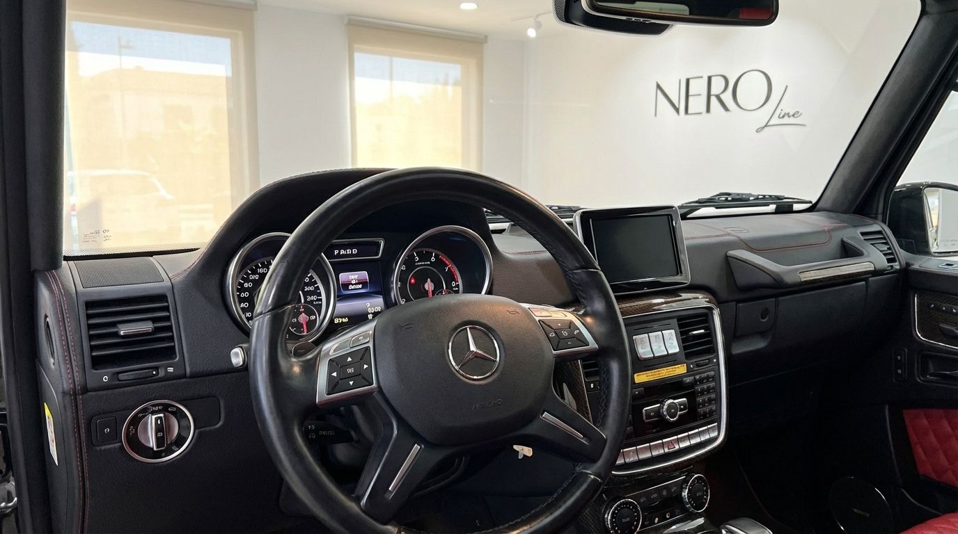 The luxurious black interior of the Mercedes-Benz G-Class Brabus G800 Rocket, showcasing the driver's cockpit, steering wheel, and dashboard in Alicante.