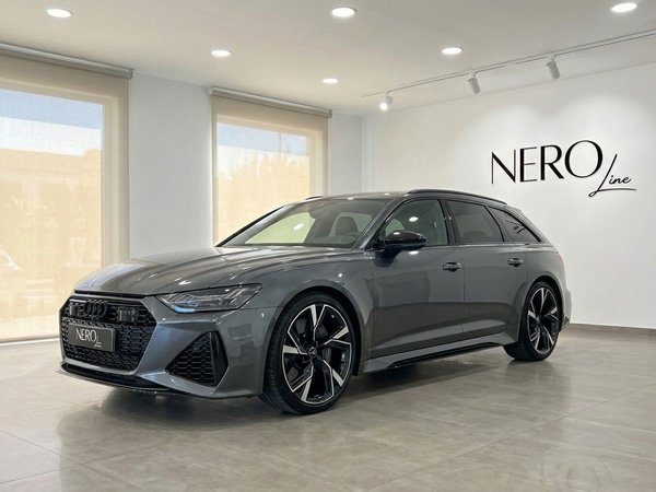 Audi RS6 — Front three-quarter view, Marbella The 2022 Audi RS6 in gloss metallic Daytona Grey Metallic, displayed in a front three-quarter view, parked in a Marbella showroom.